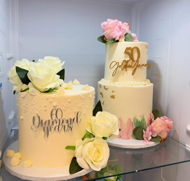 Celebration cakes on display in the shop fridge at Cakes by Poppy Elcoate